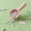 Par-Tee Prize Bead Scoop with pastel beads in pink, mint, and pearl